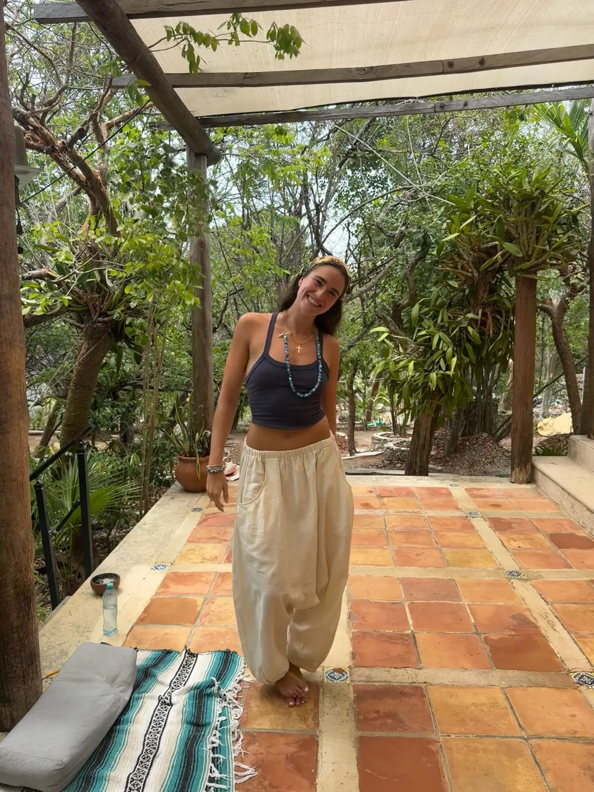 Tatiana Gentile smiling on a tropical terrace